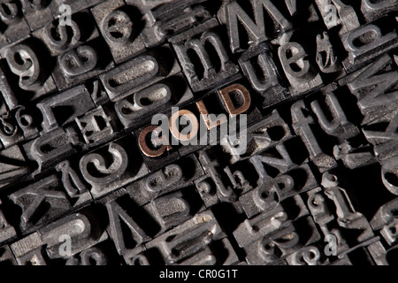The word 'gold', made of old lead type Stock Photo