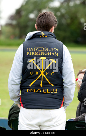 Young male student wearing University of Birmingham Polo Club jacket Stock Photo
