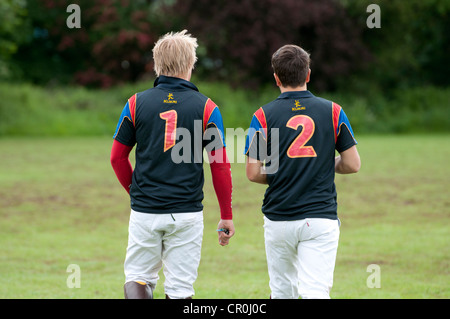 Male student polo players with numbers one and two on back Stock Photo