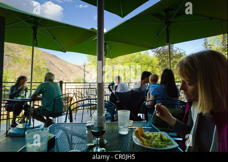 Dinners in the Boathouse Cantina restaurant & bar, along the Arkansas River, downtown Salida, Colorado, USA Stock Photo