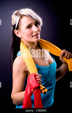 Young woman exercising with resistance bands Stock Photo