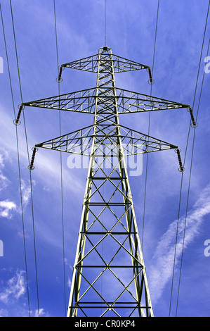 Electricity pylon against a blue sky Stock Photo