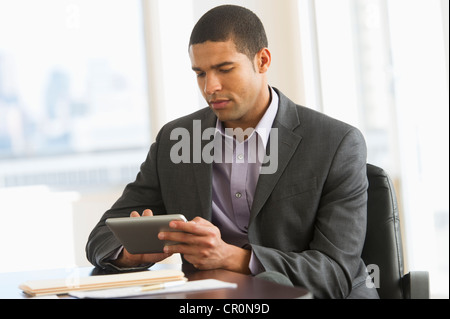 USA, New Jersey, Jersey City, Businessman using tablet pc Stock Photo