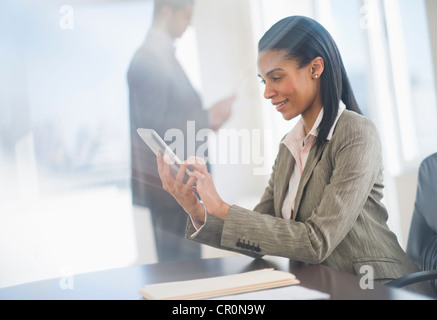 USA, New Jersey, Jersey City, Business woman using tablet pc Stock Photo