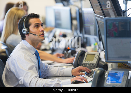 USA, New York, New York City, Traders at trading desk Stock Photo