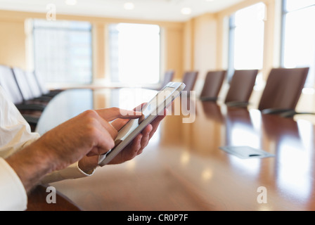 USA, New York, New York City, Hands of businessman using tablet pc Stock Photo