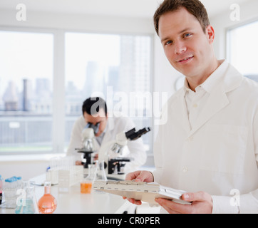 Scientists working in laboratory Stock Photo
