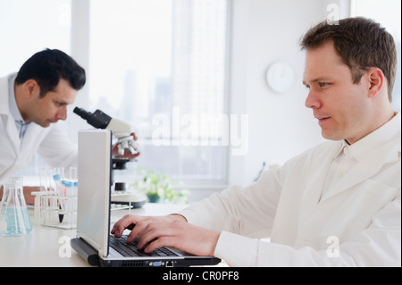Scientists working in laboratory Stock Photo