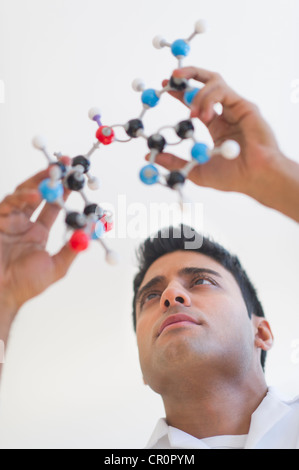 USA, New Jersey, Jersey City, Man holding molecular model Stock Photo