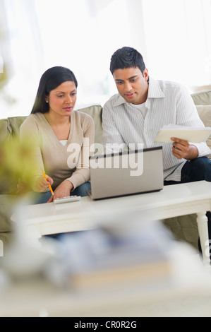 USA, New Jersey, Jersey City, Couple using laptop Stock Photo