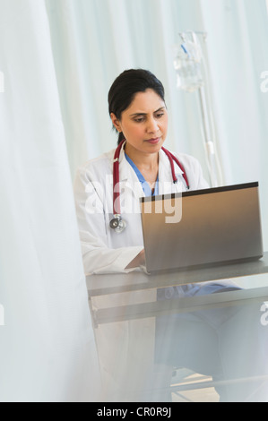 USA, New Jersey, Jersey City, Doctor working on laptop Stock Photo