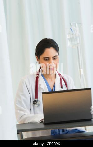 USA, New Jersey, Jersey City, Doctor working on laptop Stock Photo
