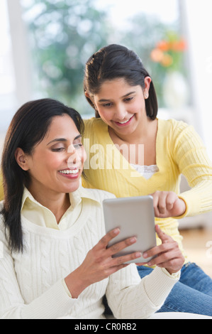USA, New Jersey, Jersey City, Mother and daughter (12-13) using digital tablet Stock Photo
