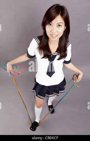 School girl plays internet lines Stock Photo
