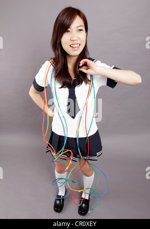 School girl plays internet lines Stock Photo