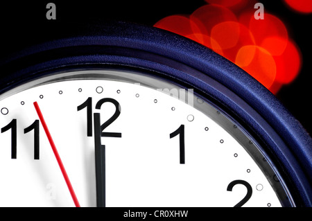 Office clock about to show midnight - few seconds to New Year Stock Photo