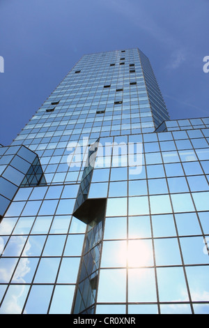Modern skyscraper in Warsaw with sun reflex in glasses Stock Photo