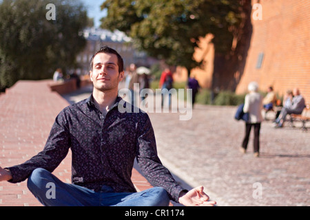 Handsome young man relaxing in the city Stock Photo