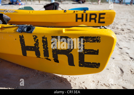 Beach at Coral Bay in Western Australia. Two canoe's for hire on the beach Stock Photo