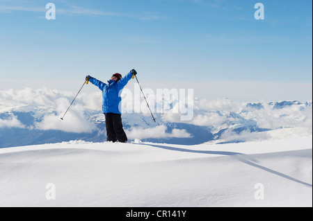 Boy holding ski poles in snow Stock Photo