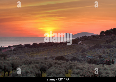 Sunset over water in rural landscape Stock Photo