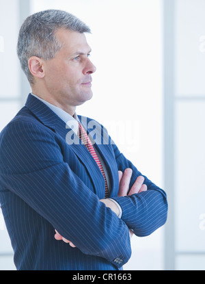 Portrait of a businessman with his arms crossed Stock Photo - Alamy