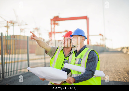 Construction workers talking on site Stock Photo