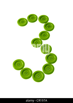 Studio shot of green buttons arranged in number three Stock Photo