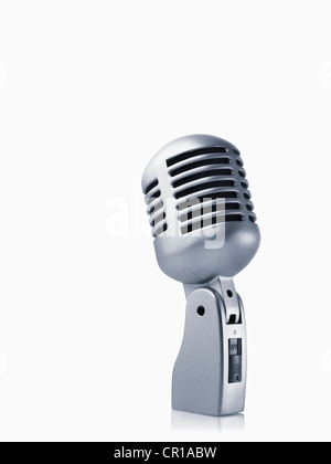 Studio shot of vintage-themed modern microphone on white background Stock Photo