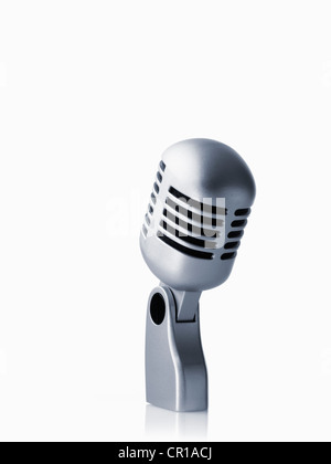 Studio shot of vintage-themed modern microphone on white background Stock Photo