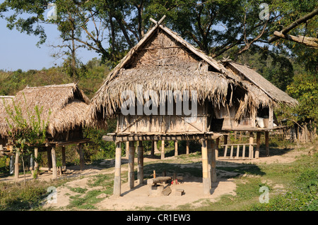 Thatched bamboo rice storage huts Ban Prane Khmu ethnic village Northern Laos Stock Photo