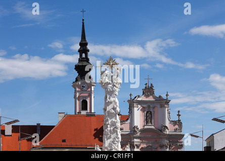 Holy Trinity column and Franciscan Church, Rathausplatz square, St. Poelten, Mostviertel, Must Quarter, Lower Austria, Austria Stock Photo