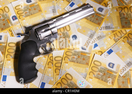 Handgun and 200 Euro bills Stock Photo