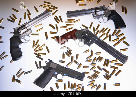 Various handguns and bullets Stock Photo