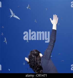 Businesswoman cheering outdoors Stock Photo