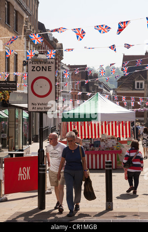 Pedestrian zone sign and shoppersw on winchester high street Stock Photo