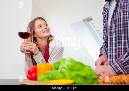 Couple cooking together in kitchen Stock Photo