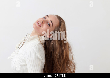 Smiling woman tossing hair Stock Photo