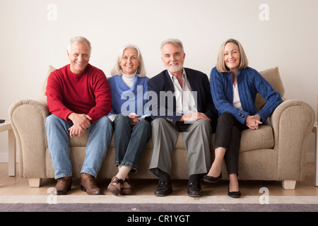 USA, California, Los Angeles, Two senior couples on sofa Stock Photo