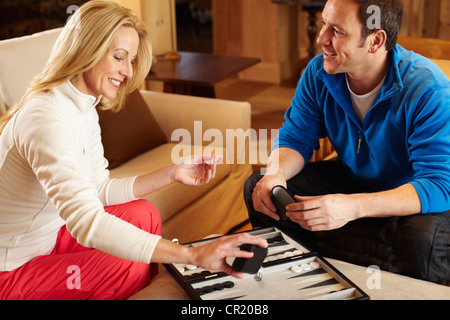 Couple playing backgammon together Stock Photo