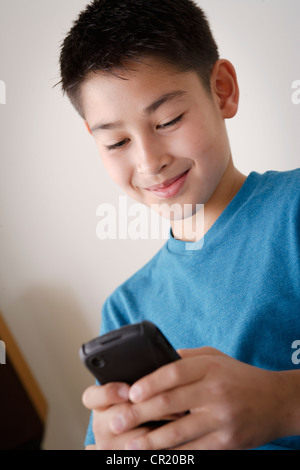 USA, California, Los Angeles, Boy (10-11) using mobile phone Stock Photo
