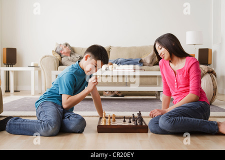 USA, California, Los Angeles, Siblings playing chess game Stock Photo