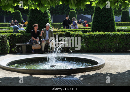 Mont des Arts in central Brussels.  Kunstberg.  People seated close to trees and modern architecture. Stock Photo