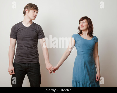 Happy young couple posing in studio Stock Photo