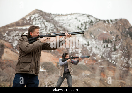 USA, Utah, Spanish Fork, Men in mountains shooting Stock Photo