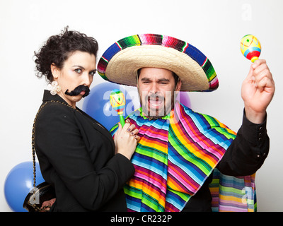 Studio Shot of two people dressed up as Mexicans