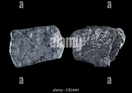Two chunks of bituminous coal use to generate power isolated on black. Stock Photo