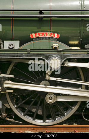 Nameplate and driving wheels of preserved LMS Jubilee Class steam locomotive 5596 'Bahamas'. Stock Photo