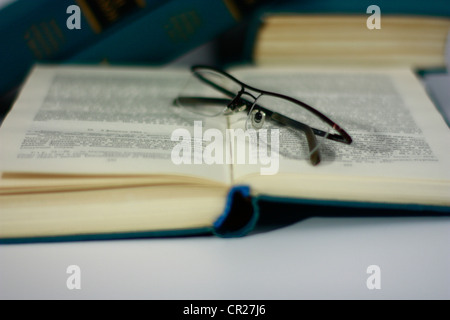 Eyeglasses on books Stock Photo