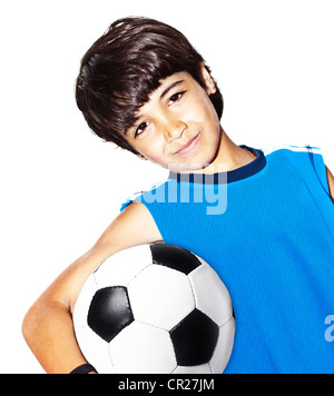 Cute boy playing football, isolated portrait of a healthy preteen having fun, kids activities, little footballer Stock Photo